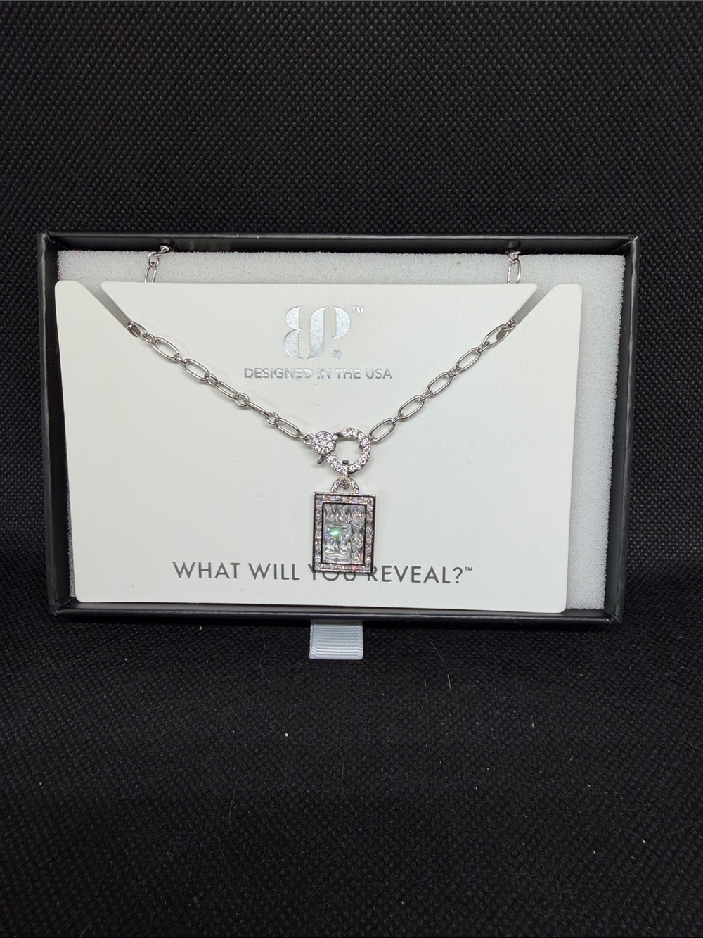 April: CZ and Rhodium Dog Tag